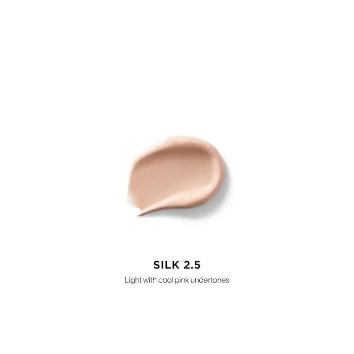 The Hourglass Vanish Airbrush Concealer features a distinctive metallic bronze cap with a slanted geometric design and a soft doe-foot applicator