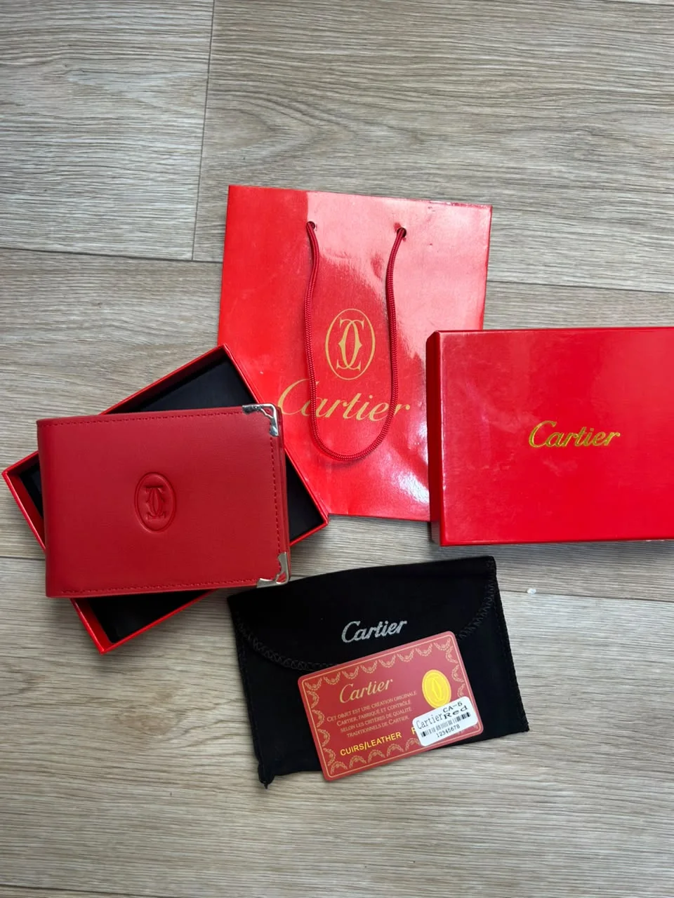 PORTE MONNAIE CARTIER ROUGE HOMMES  AVEC SACHET